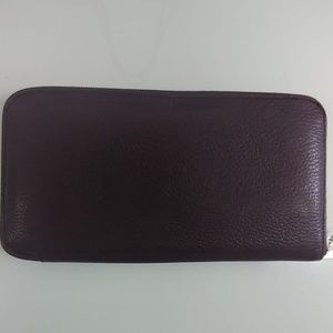 Hermes zipped wallet.